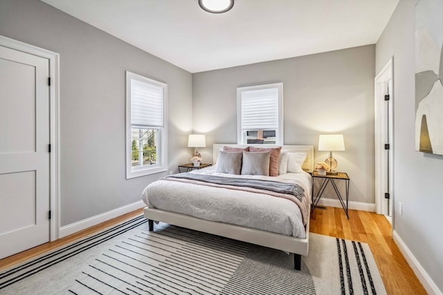 bedroom with light hardwood / wood-style flooring