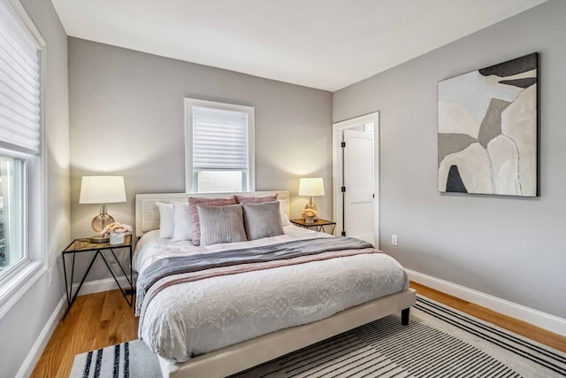 bedroom with hardwood / wood-style floors