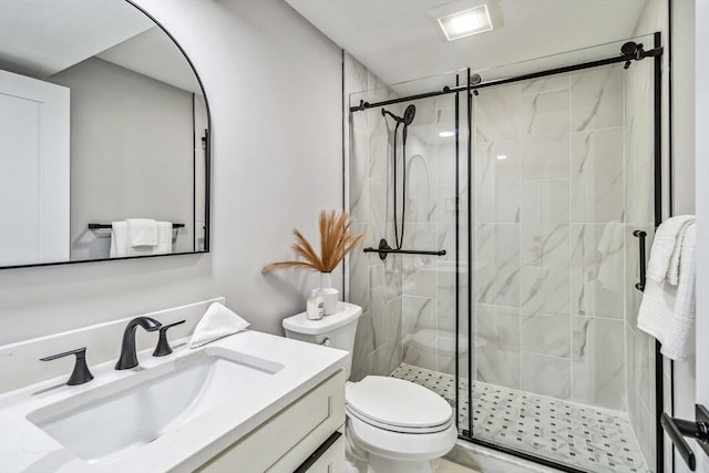 bathroom with vanity, toilet, and an enclosed shower