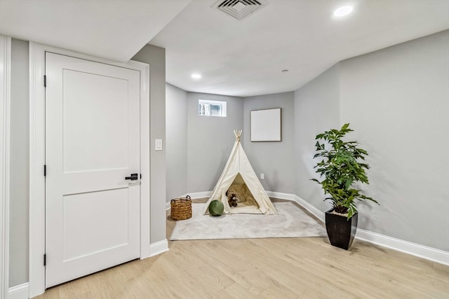 rec room featuring light hardwood / wood-style flooring