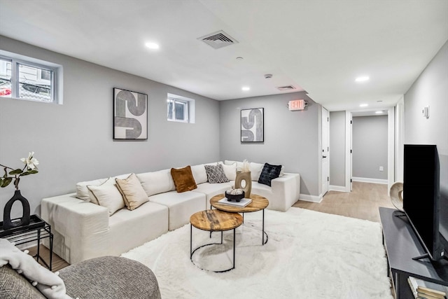 living room featuring light hardwood / wood-style floors and plenty of natural light