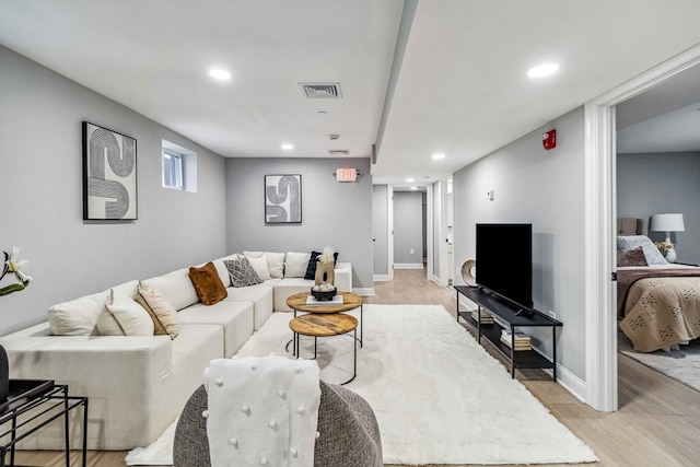 living room with light hardwood / wood-style floors