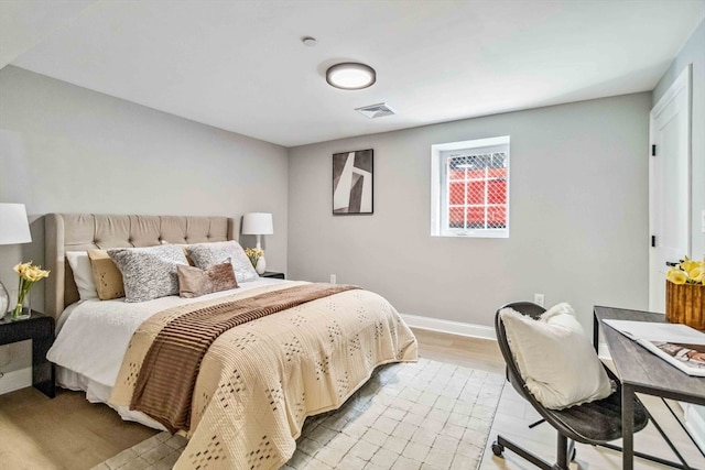 bedroom with light wood-type flooring