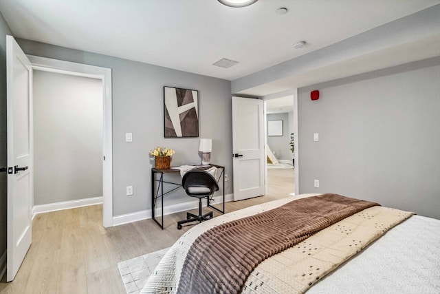 bedroom with light hardwood / wood-style flooring