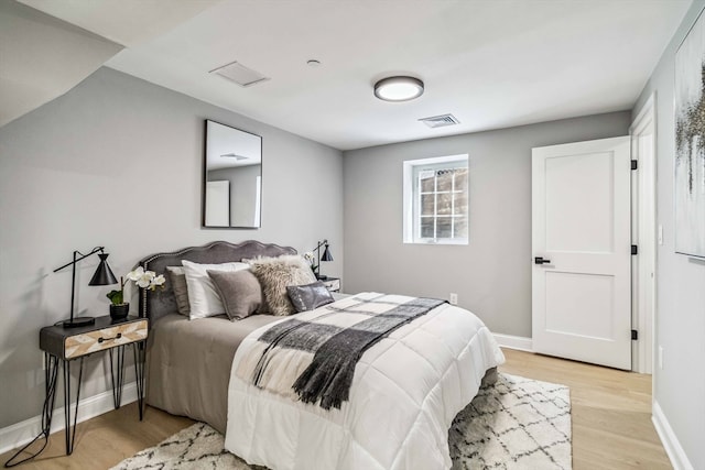 bedroom with light hardwood / wood-style flooring