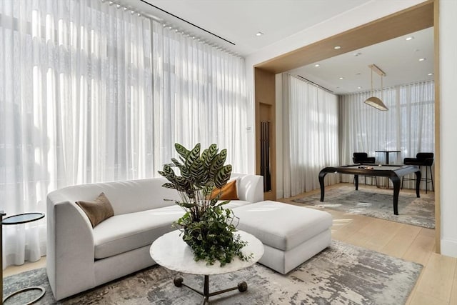 living room featuring recessed lighting and light wood-style floors