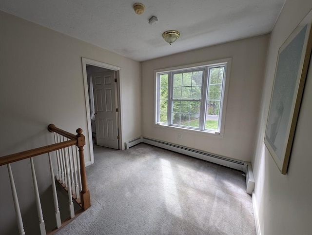 83 Haggerty Rd, Charlton, MA 01507 - spare room featuring carpet floors, a baseboard radiator, a smoke detector, and baseboards