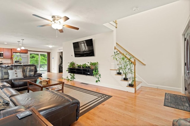 37 Leach Ave, Brockton, MA 02301 - living area featuring stairway, light wood finished floors, and ceiling fan