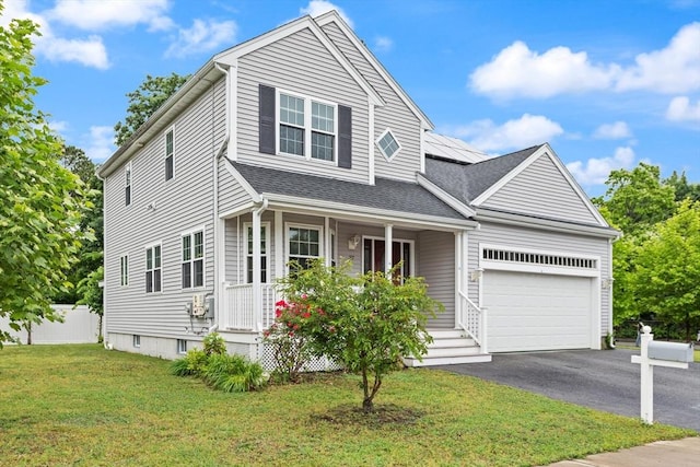 37 Leach Ave, Brockton, MA 02301 - view of front of home featuring a porch, a garage, a front lawn, roof mounted solar panels, and asphalt driveway