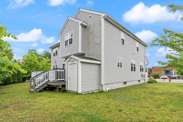 37 Leach Ave, Brockton, MA 02301 - view of home's exterior featuring a wooden deck, a yard, and stairs