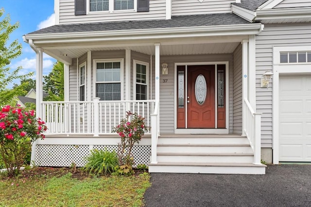 37 Leach Ave, Brockton, MA 02301 - entrance to property featuring a shingled roof and a porch