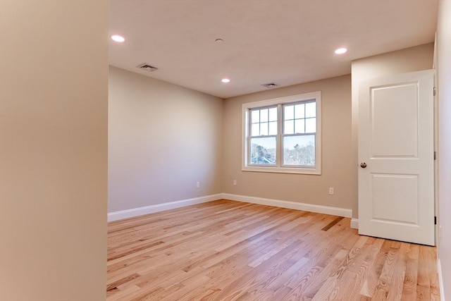 unfurnished room featuring light wood-type flooring