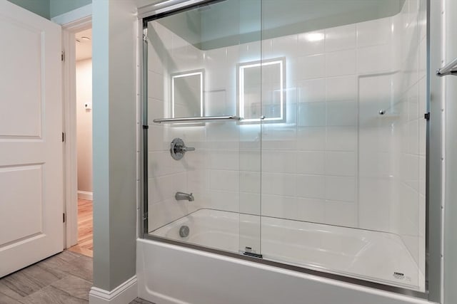 bathroom featuring combined bath / shower with glass door and hardwood / wood-style flooring