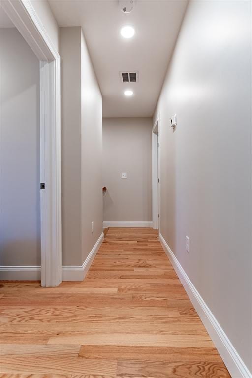 hallway featuring light hardwood / wood-style flooring