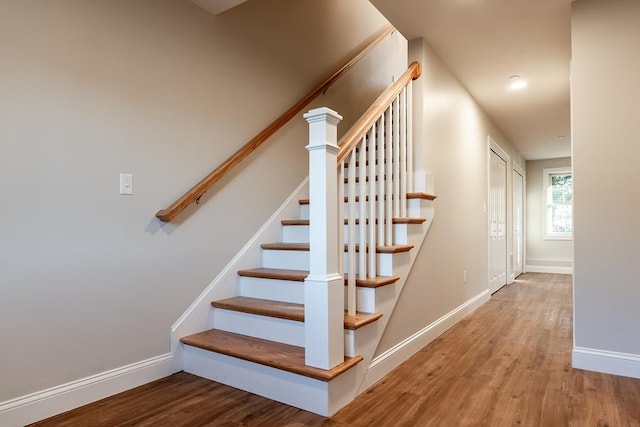 stairway featuring hardwood / wood-style floors