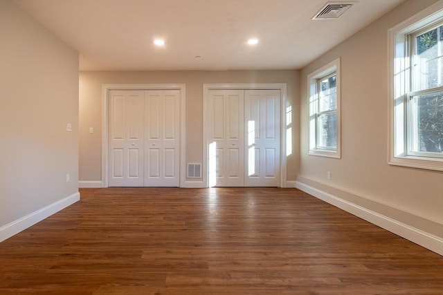 entryway with dark hardwood / wood-style flooring