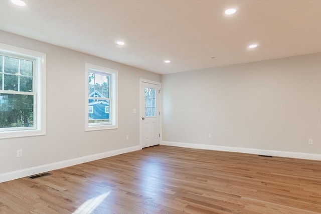 empty room with light wood-type flooring