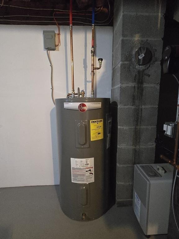 utility room featuring water heater