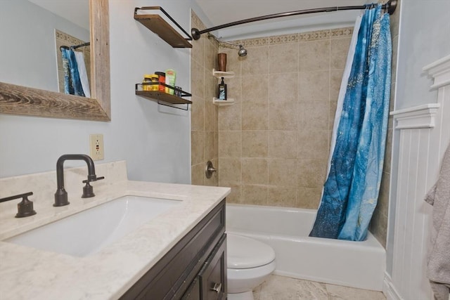 bathroom featuring toilet, shower / bath combo, and vanity