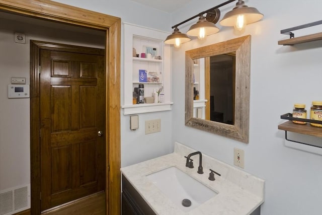 bathroom featuring visible vents and vanity