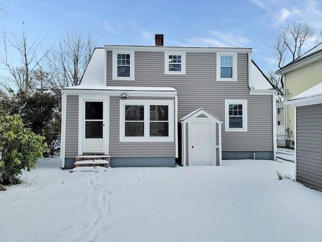 view of snow covered house