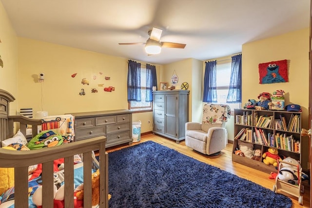 bedroom featuring wood finished floors and a ceiling fan