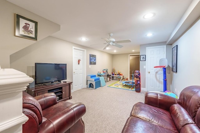 living room featuring carpet floors, a ceiling fan, baseboards, and recessed lighting