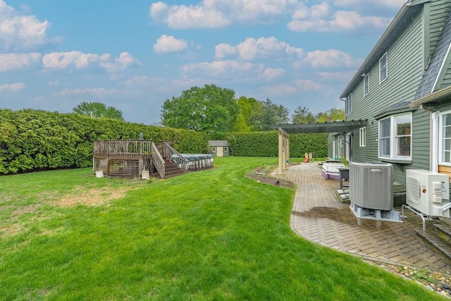 view of yard with ac unit, a patio area, a pergola, central AC unit, and a deck