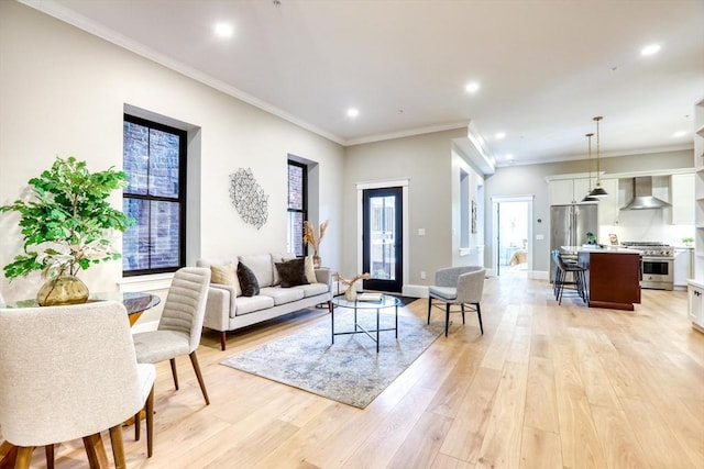 living room featuring light hardwood / wood-style flooring and ornamental molding