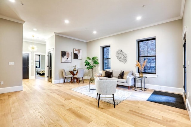 living room featuring crown molding and light hardwood / wood-style floors