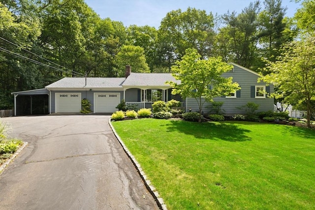 5-R Valeda, Rehoboth, MA 02769 - view of front of house with a garage, driveway, a carport, a front yard, and a chimney