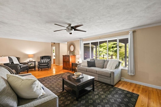 5-R Valeda, Rehoboth, MA 02769 - living area featuring wood finished floors, ceiling fan, baseboards, a textured ceiling, and crown molding