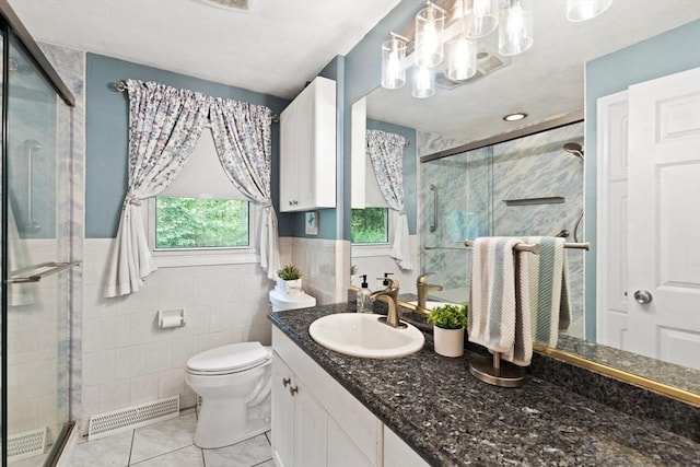5-R Valeda, Rehoboth, MA 02769 - full bath with tile walls, a shower stall, vanity, toilet, and tile patterned floors