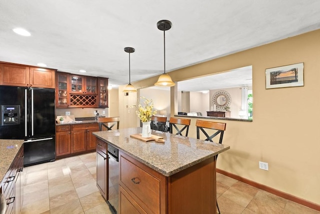 5-R Valeda, Rehoboth, MA 02769 - kitchen featuring black fridge, brown cabinets, baseboards, glass insert cabinets, and a center island