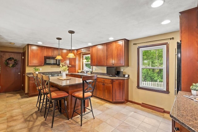 5-R Valeda, Rehoboth, MA 02769 - kitchen featuring black microwave, a kitchen bar, recessed lighting, a kitchen island, and baseboards