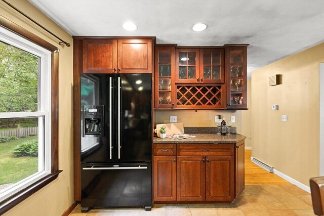 5-R Valeda, Rehoboth, MA 02769 - kitchen with black fridge, glass insert cabinets, baseboards, dark stone counters, and recessed lighting