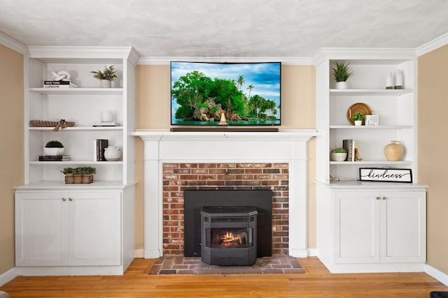 5-R Valeda, Rehoboth, MA 02769 - living area featuring light wood finished floors, built in shelves, a brick fireplace, crown molding, and baseboards