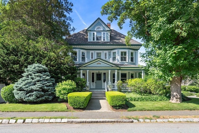 victorian-style house with a porch