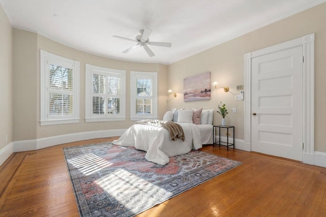 bedroom featuring ceiling fan and wood-type flooring