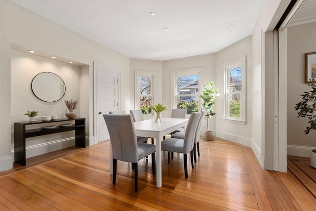 dining area with light hardwood / wood-style floors