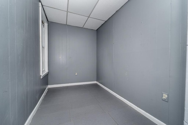 spare room featuring a paneled ceiling