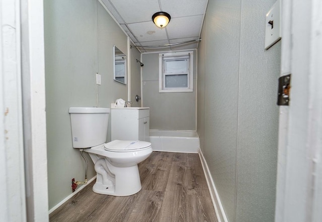 bathroom featuring toilet, vanity, and hardwood / wood-style flooring