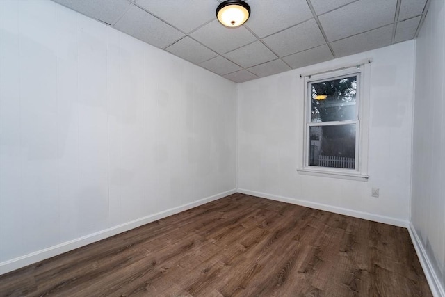 empty room with dark wood-type flooring