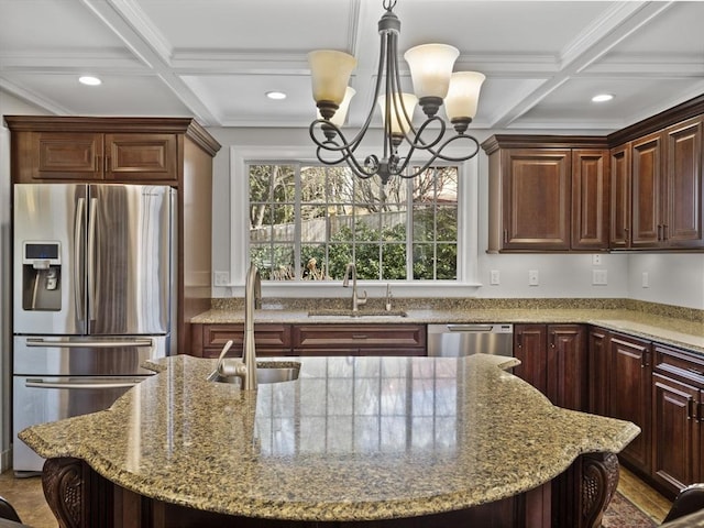 kitchen with appliances with stainless steel finishes, coffered ceiling, and a sink