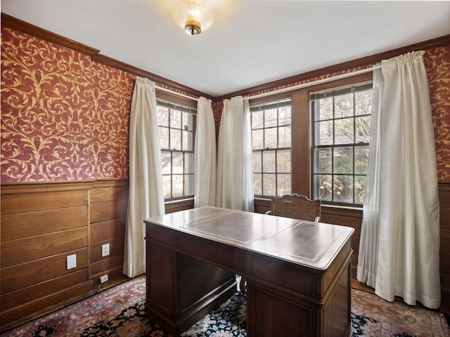 unfurnished office with wallpapered walls, wooden walls, and wainscoting