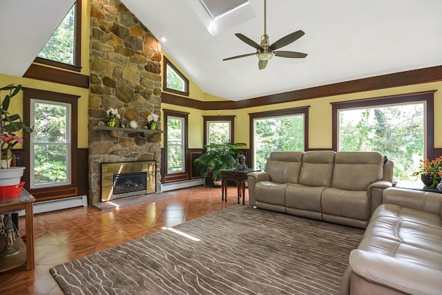 living room featuring a wealth of natural light and baseboard heating