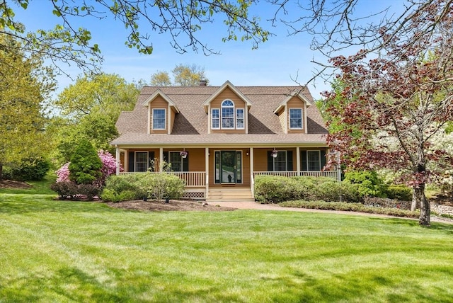 5 Campbell Rd, Middleton, MA 01949 - new england style home featuring a front yard, covered porch, a chimney, and roof with shingles