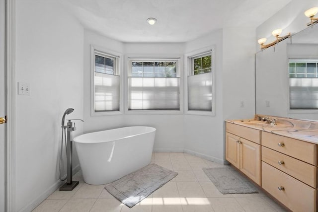 5 Campbell Rd, Middleton, MA 01949 - bathroom with baseboards, vanity, a freestanding tub, and tile patterned flooring