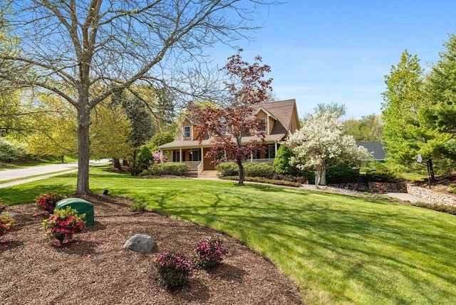 5 Campbell Rd, Middleton, MA 01949 - obstructed view of property featuring a front lawn and covered porch