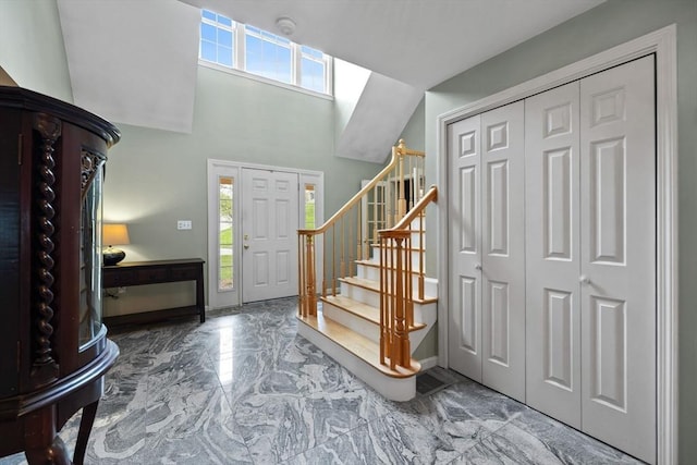 5 Campbell Rd, Middleton, MA 01949 - entrance foyer featuring marble tiled floors, stairway, baseboards, and a high ceiling